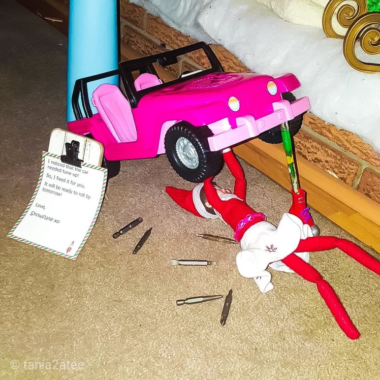Snowflake the Elf on the Shelf fixing her Barbie car: tania2atee