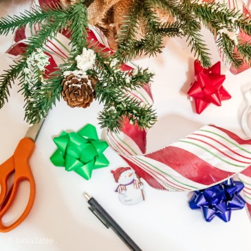 Christmas tree with ribbon, tag, scissors and bows
