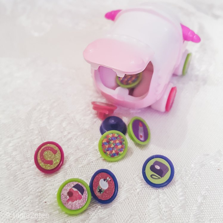 Assortment of Ritzy Rollerz miniature car collectible toy with charms and trunk