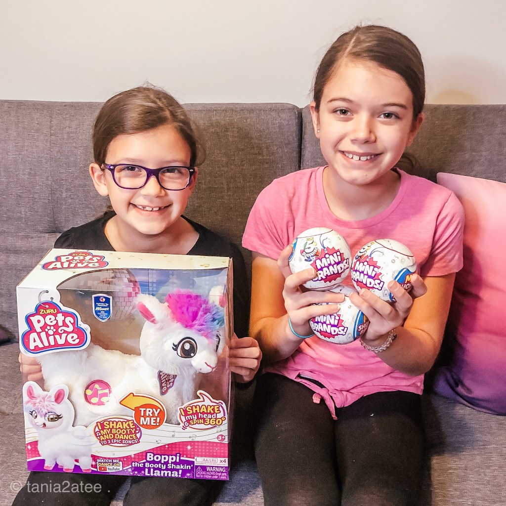 two girls holding toys