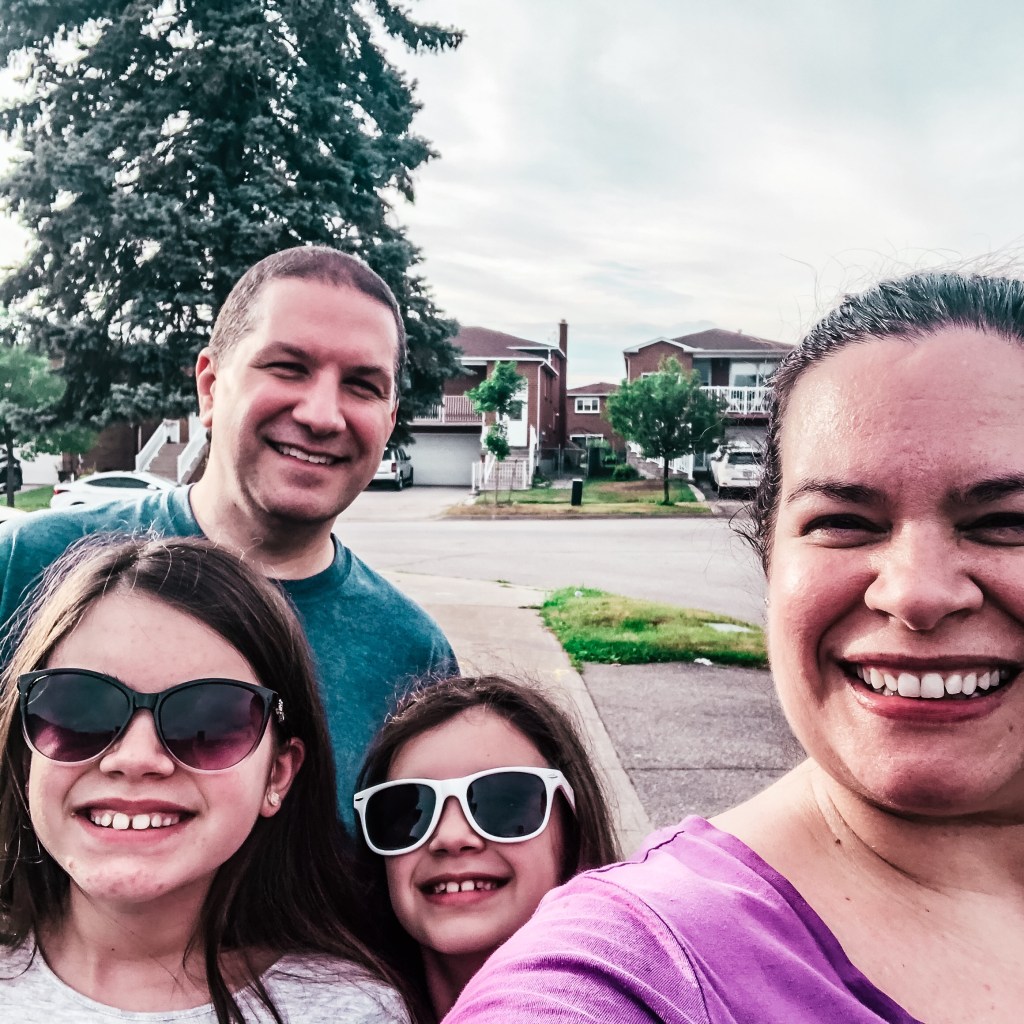 Woman, man and two girls taking a selfie